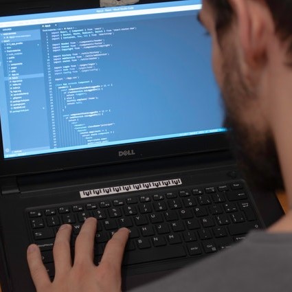 Girl is working on laptop at a remote job.png